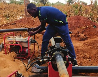 Technician fusing HDPE pipe